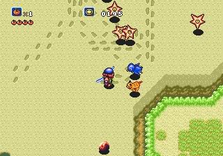 Capture d'écran montrant le protagoniste en action sur une plage avec des ennemies en forme d'étoiles de mer flottant au-dessus du sable